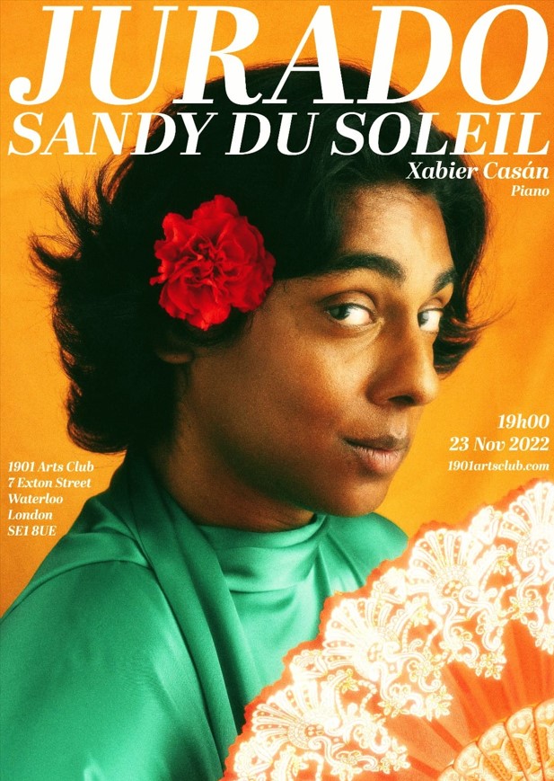 Sandy du Soleil with a carnation and fan