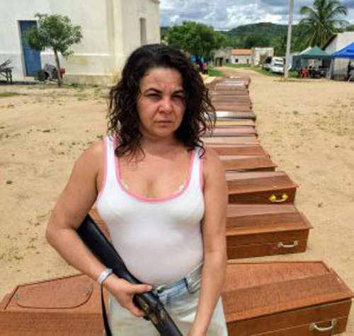 villager(Suzy Lópes)  protects the coffins for the dead.jpg