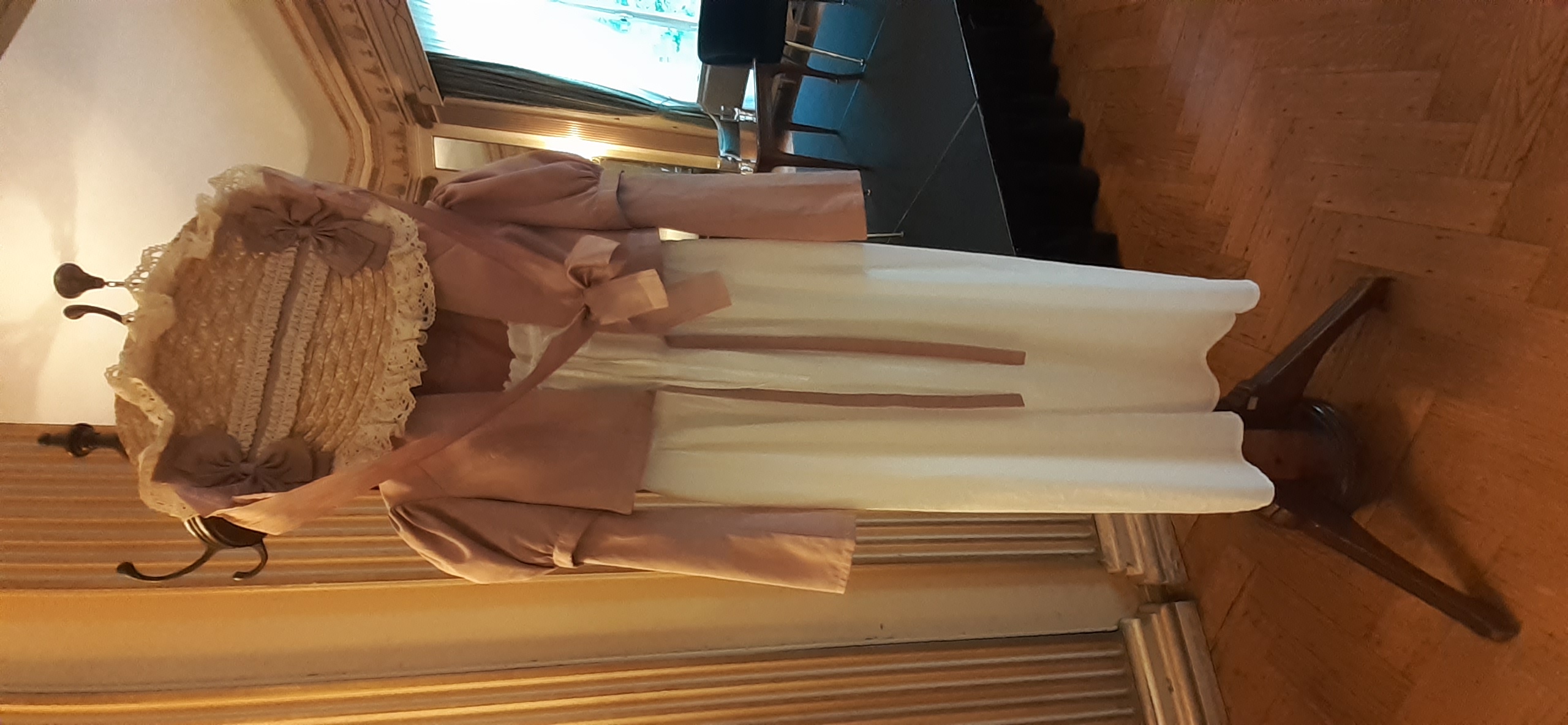 A regency dress and bonnet