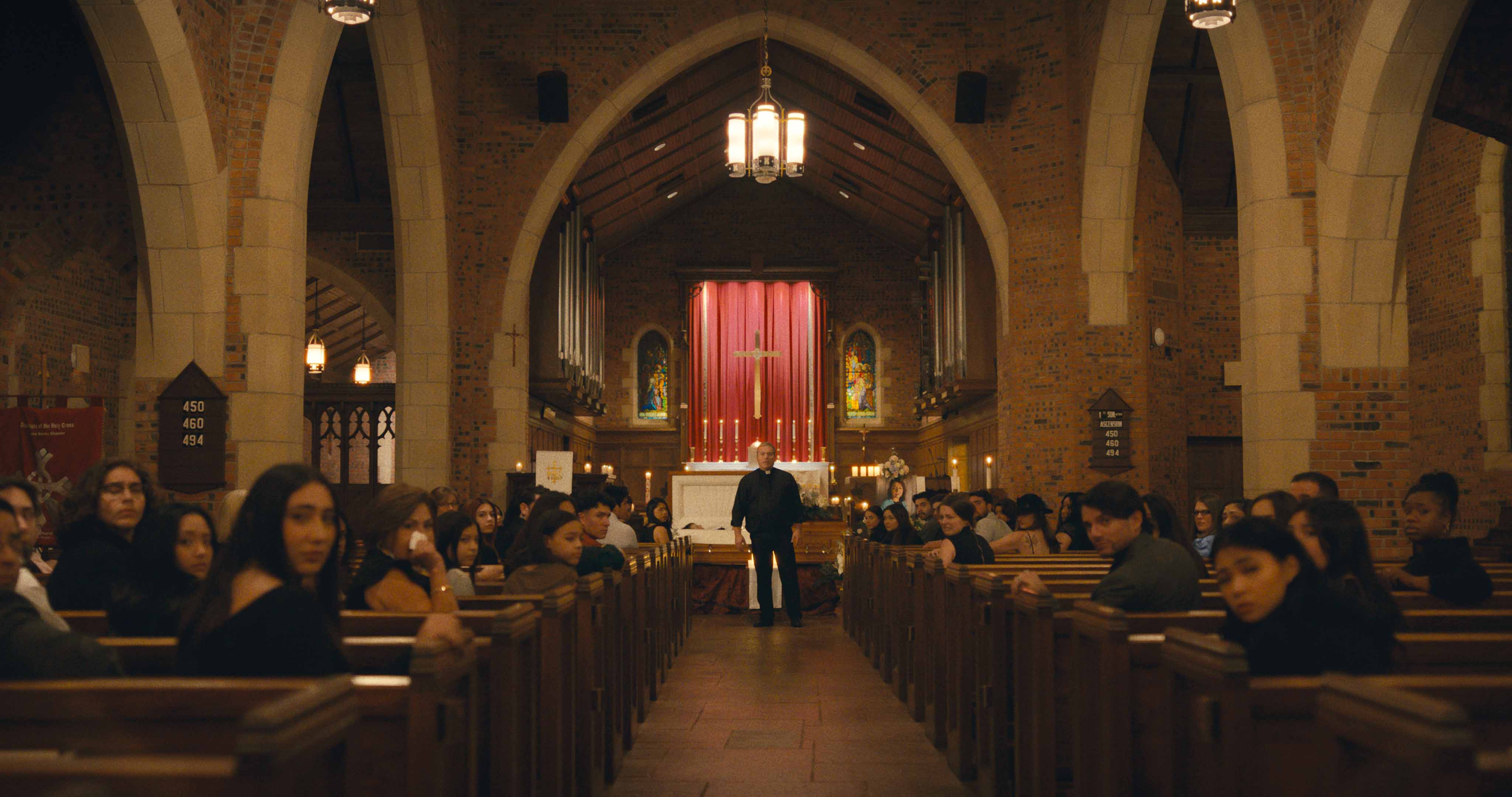 Julio César Cedillo as Padre Tomás in his church church 